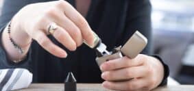 person holding silver flip lighter