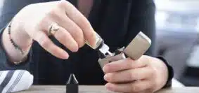 person holding silver flip lighter